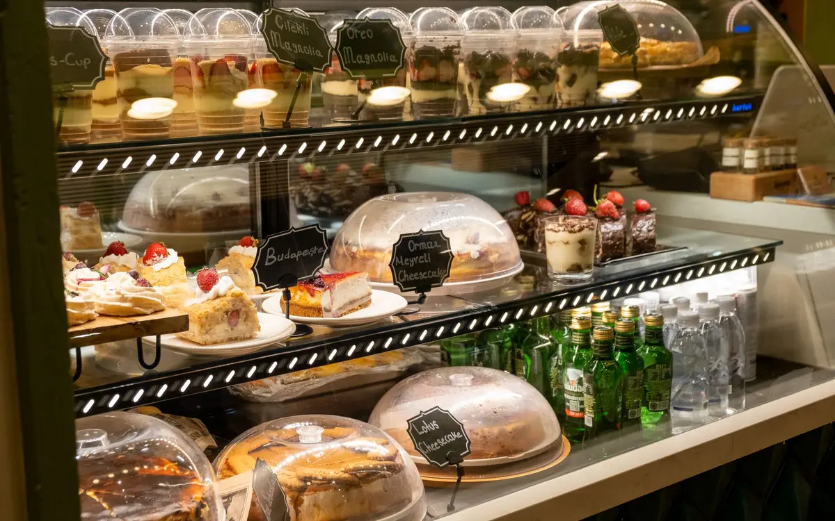 Cakes and desserts in a patisserie display case